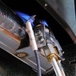 Close up of pilot light blue flames