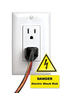 Cord plugged in outlet with wires exposed